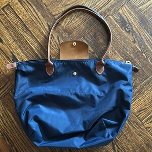 Long champ bag with signs of use! Beautiful bag.